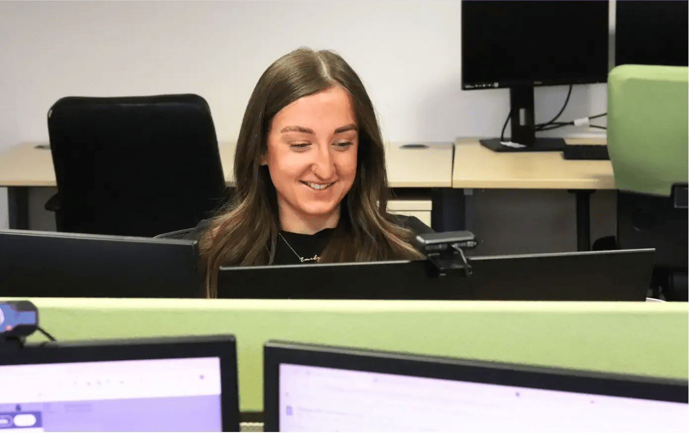 Emily at JDR increasing website traffic on her computer